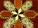 a close up of a wooden cross with a design on it