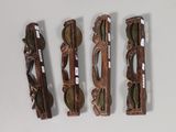 three pairs of glasses are sitting next to each other on a table