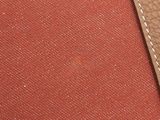 an image of a close up of a red and brown bag