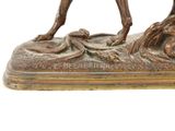 bronze statue of a man riding a horse with a dog on it