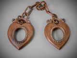 a pair of antique wooden heart shaped key chains