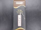 a cardboard box with a white electronic device inside of it