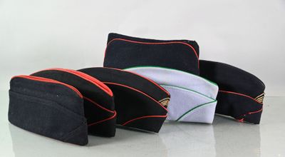 three pieces of black and red bags sitting on top of a table