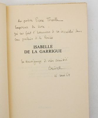 an open book with a handwritten poem on it sitting on top of a table
