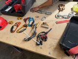 a man sitting at a table with many tools on it