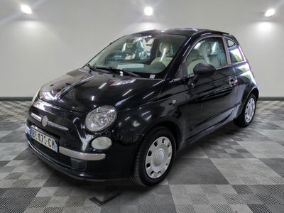 a picture of a small black car on a checkered floor