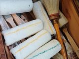 a wooden box filled with cleaning supplies on the floor