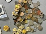 a lot of coins that are sitting on a table