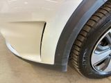 a close up of a car ' s tire on the side of the road
