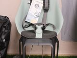 a baby car seat with a seat belt attached to it