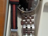 a watch that is sitting in a box with a watch on it