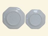 two plates that are sitting side by side on a table