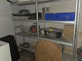 a room with a shelf with a lot of items on it