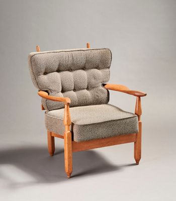 an image of a chair with a cushion and a wooden frame