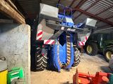 a tractor that is parked in a garage