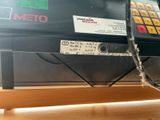 a picture of a cash machine with a price tag attached to it