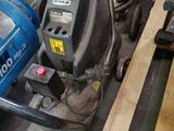 a blue machine that is sitting on the floor