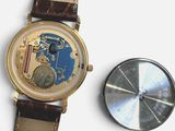 a close up of a wrist watch and a watch face