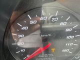 a close up of a speedometer on a car ' s dashboard
