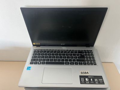 an open laptop computer sitting on top of a wooden table