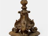 an old wooden table with a vase on top of it