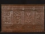 an old wooden chest with carvings and carvings on the sides