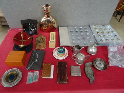 a red table with a red table cloth and silver items on it