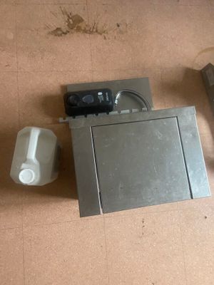 an overhead view of a microwave and a toaster on the floor