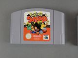 two nintendo gameboy games sitting next to each other on a table