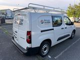 a white van that is parked in a parking lot