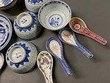 a lot of spoons and bowls sitting on a table