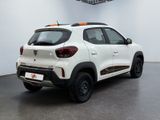 the rear end of a white car parked in a room