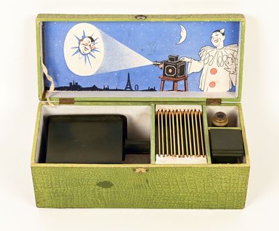 a green box with a picture of a man holding a camera
