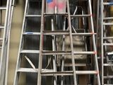many different types of ladders in a garage
