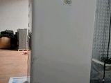 an image of a white refrigerator in a room