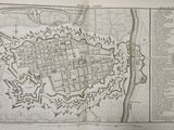 an old map of a city with a castle on top of it