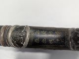 a black and gold pen with a silver handle