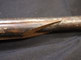 a close up of a baseball bat on a black cloth