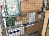 a metal cart with boxes on it in a warehouse