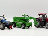 three toy tractors that are sitting next to each other