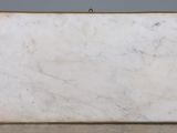 an image of a white marble slab sitting on top of a floor