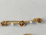 two pieces of gold and pearl brooches and a pair of scissors