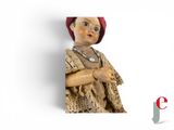 a picture of a doll with a red hat on it