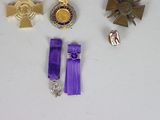 a lot of medals that are on a table