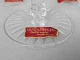 a glass of water sitting on a table with a label on it