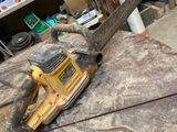 a chainsaw sitting on top of a table in a room