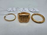 three gold rings and a gold ring with a small gold ring with a small gold ring with a small gold