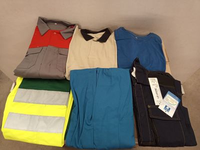 a lot of men ' s shirts and pants laid out on the floor