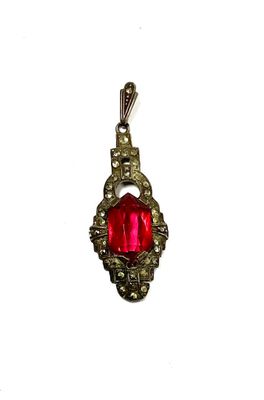 Petit pendentif en argent 800°° serti d'une pierre rouge et …