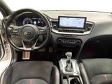 the interior of a car with a steering wheel, dashboard, and dashboard controls